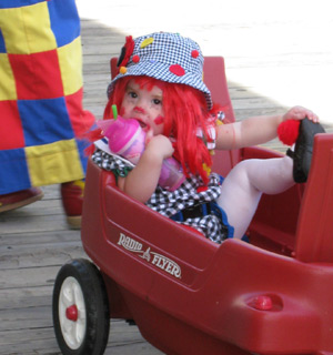 a young clown in a wagon